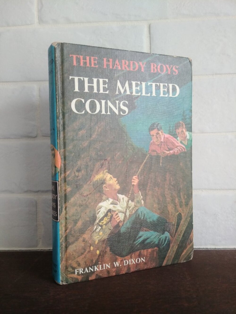 4/$20 Vintage Hardy Boys blue hardcover book #23 The Melted Coins